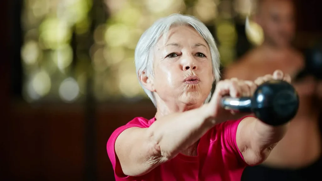 Toning Bingo Wings: Effective Exercises and Tips for Achieving Sleeker Arms 2 Person performing arm exercises with dumbbells Busby