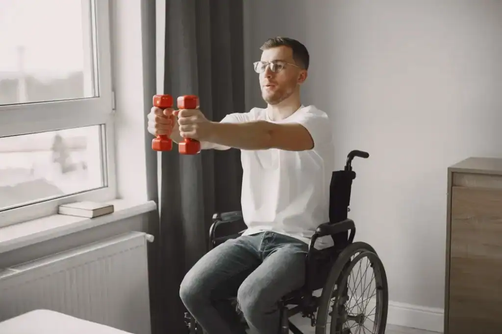 Image of man doing exercise in his wheelchair to aid weight loss Busby