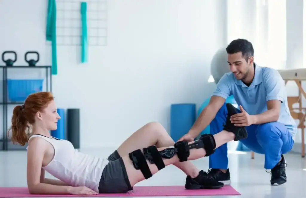 Woman having treatment to help muscle recovery Busby after an injury